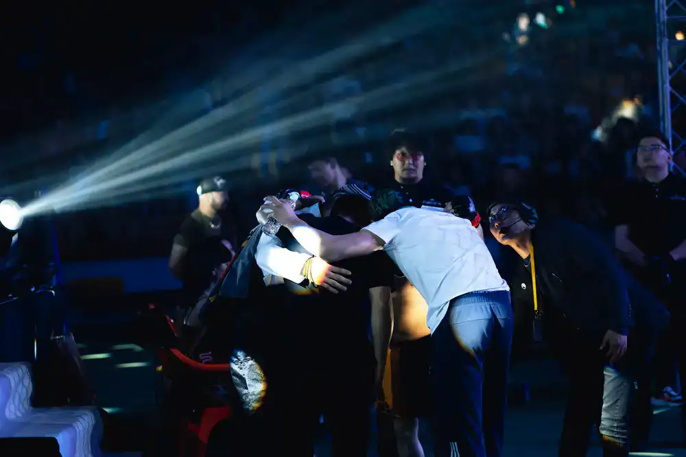 Competitors facing off under bright stage lights