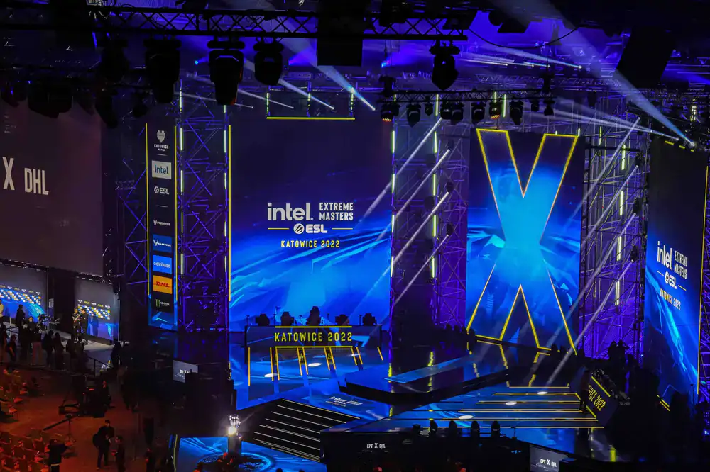Two competitors facing off on a brightly lit tournament stage