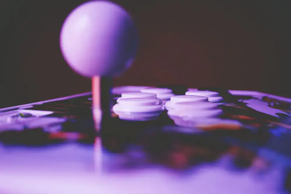 Players focused on arcade sticks in the warm-up area